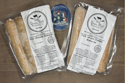 Two packages of Pork Cheddar Bratwurst and Pork Jalapeno Cheddar Bratwurst with The MF'n Farm labels on a wooden surface.