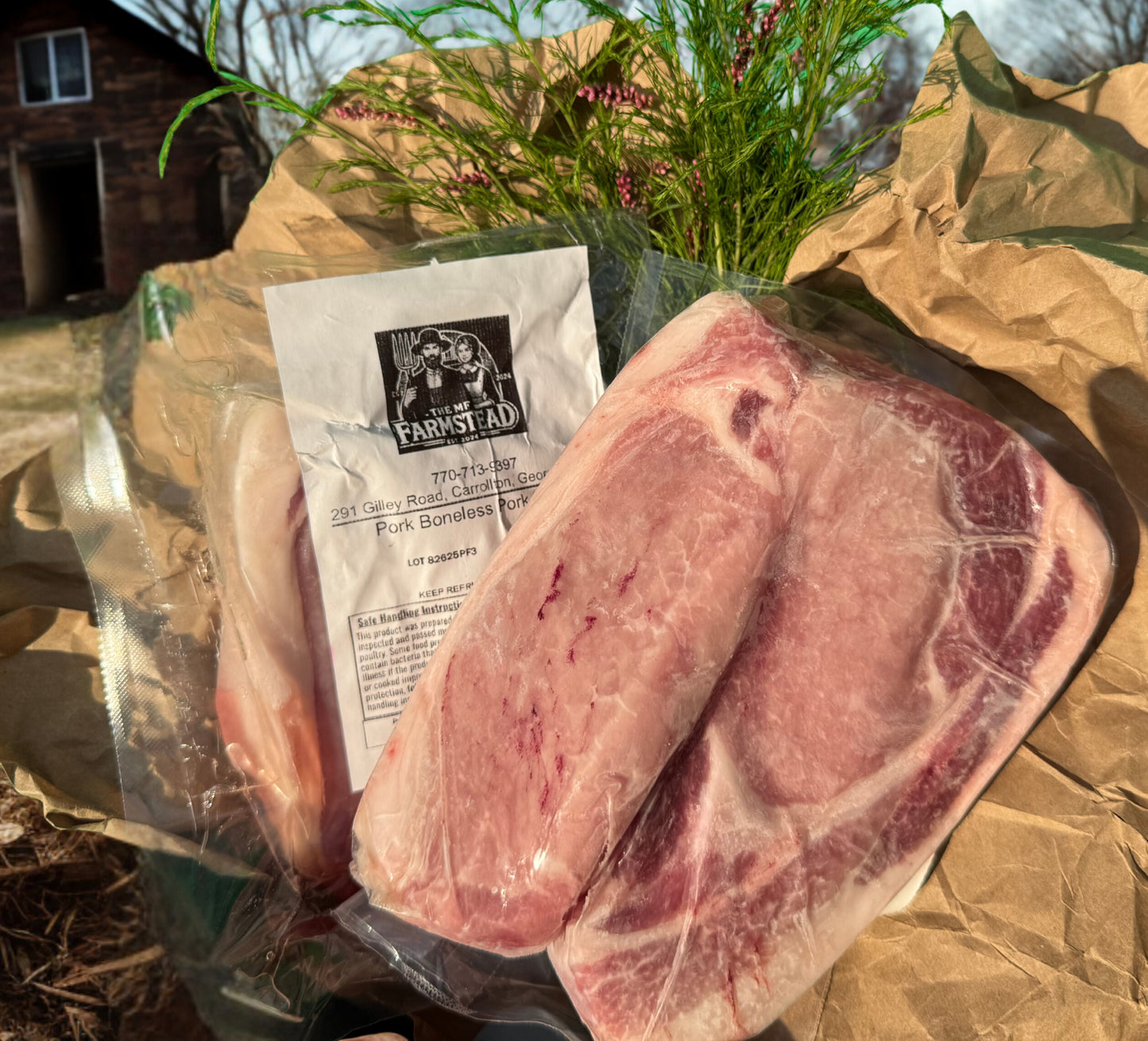 Boneless Berkshire pork chops from The MF Farmstead in Carrollton, Georgia, pasture-raised heritage pork packaged in rustic farm setting.